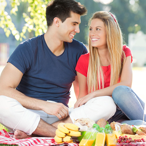 couple has a picnic outdoors during an online couples retreat or marriage intensive in California with an online therapist at the relationship therapy center